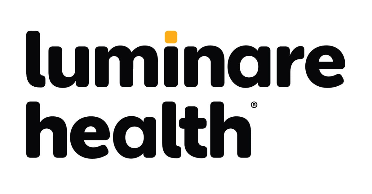 Professional psychiatrist consulting with patient in modern Stamford Connecticut medical office